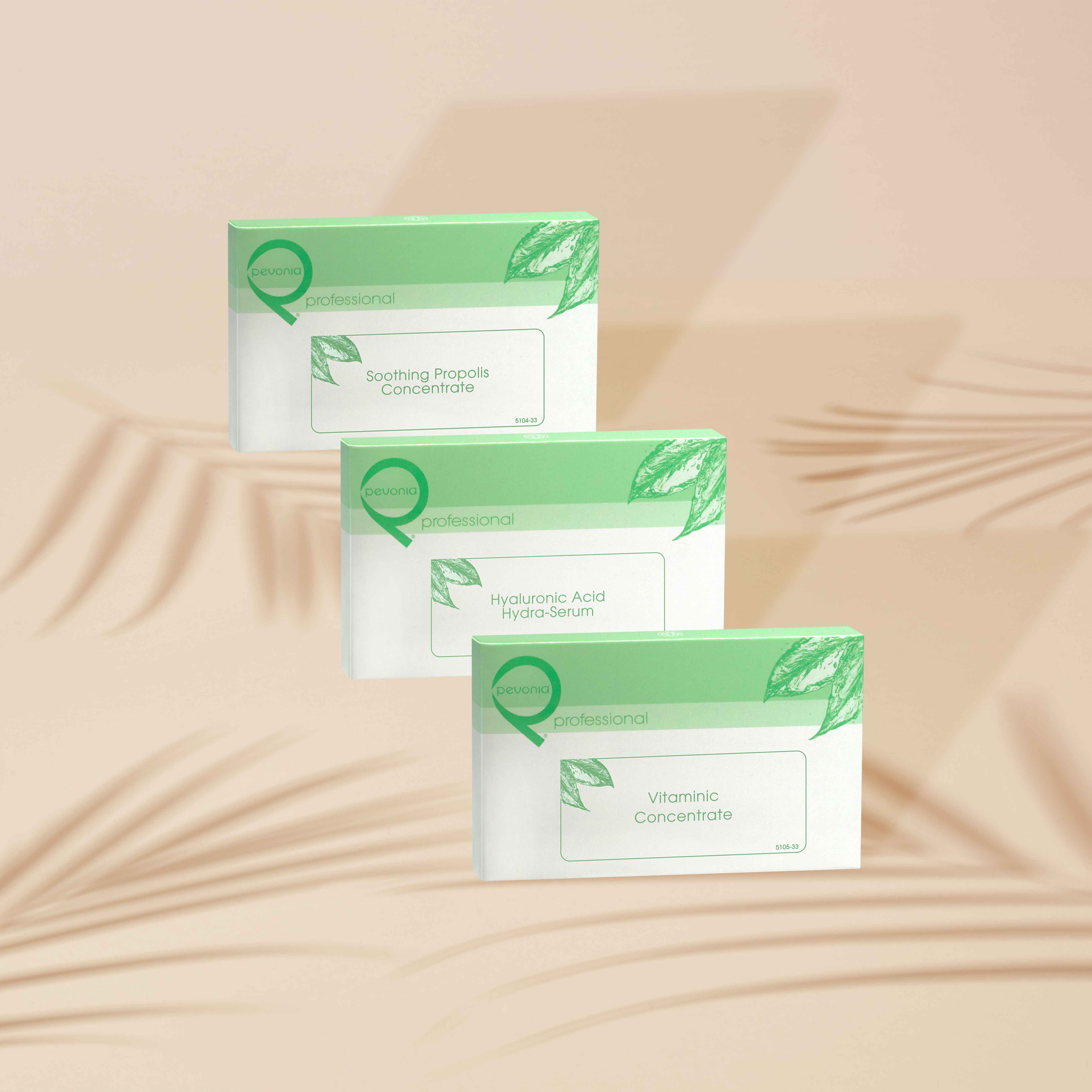 Pevonia Professional Ampoule boxes sitting sitting behind one another on a beige background.