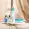 Pevonia's Dry Skin Line in front of thin curtains.